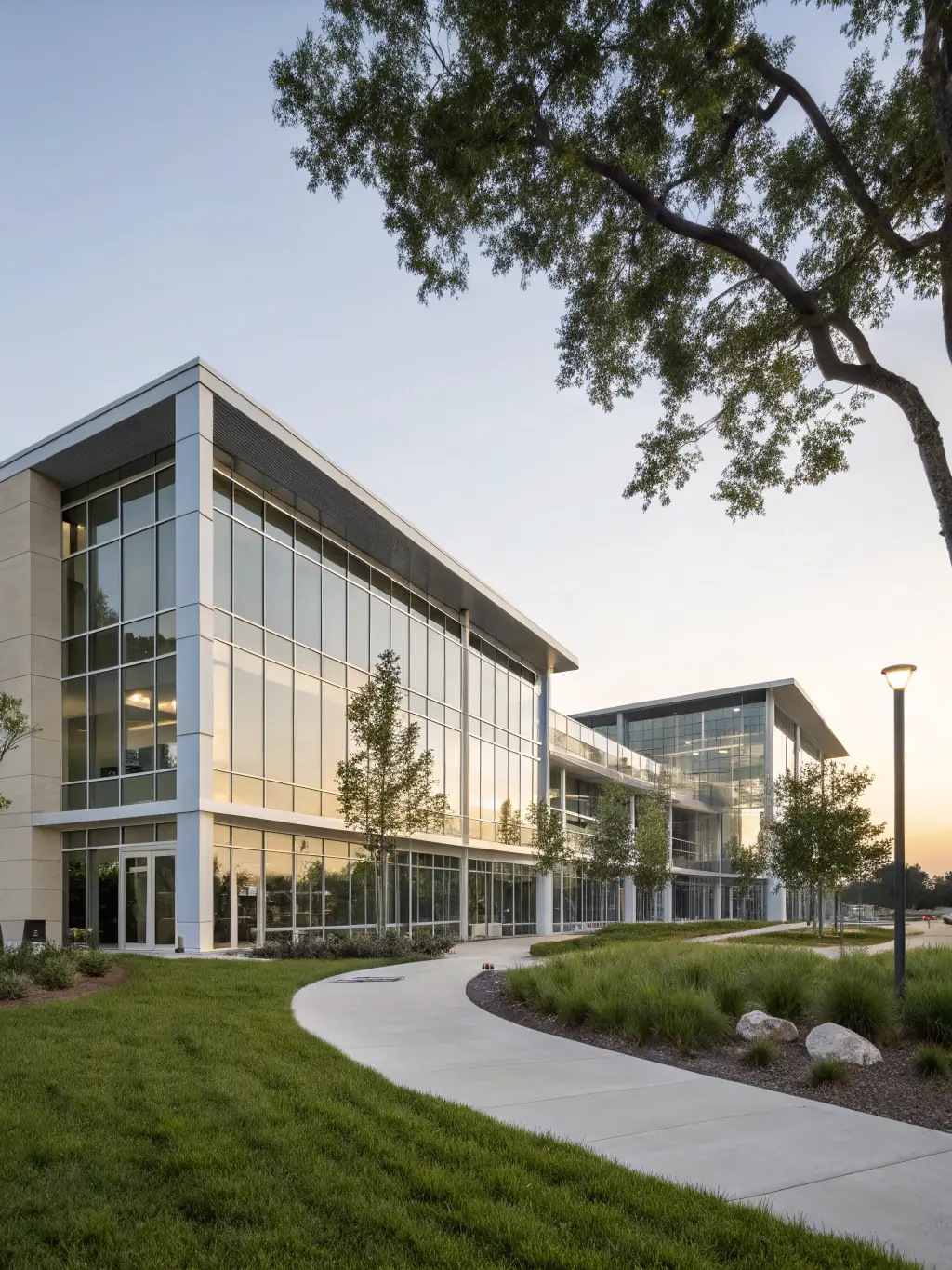 A newly constructed office building with glass facades and modern design, representing ML Contracting LLC's commercial construction capabilities.